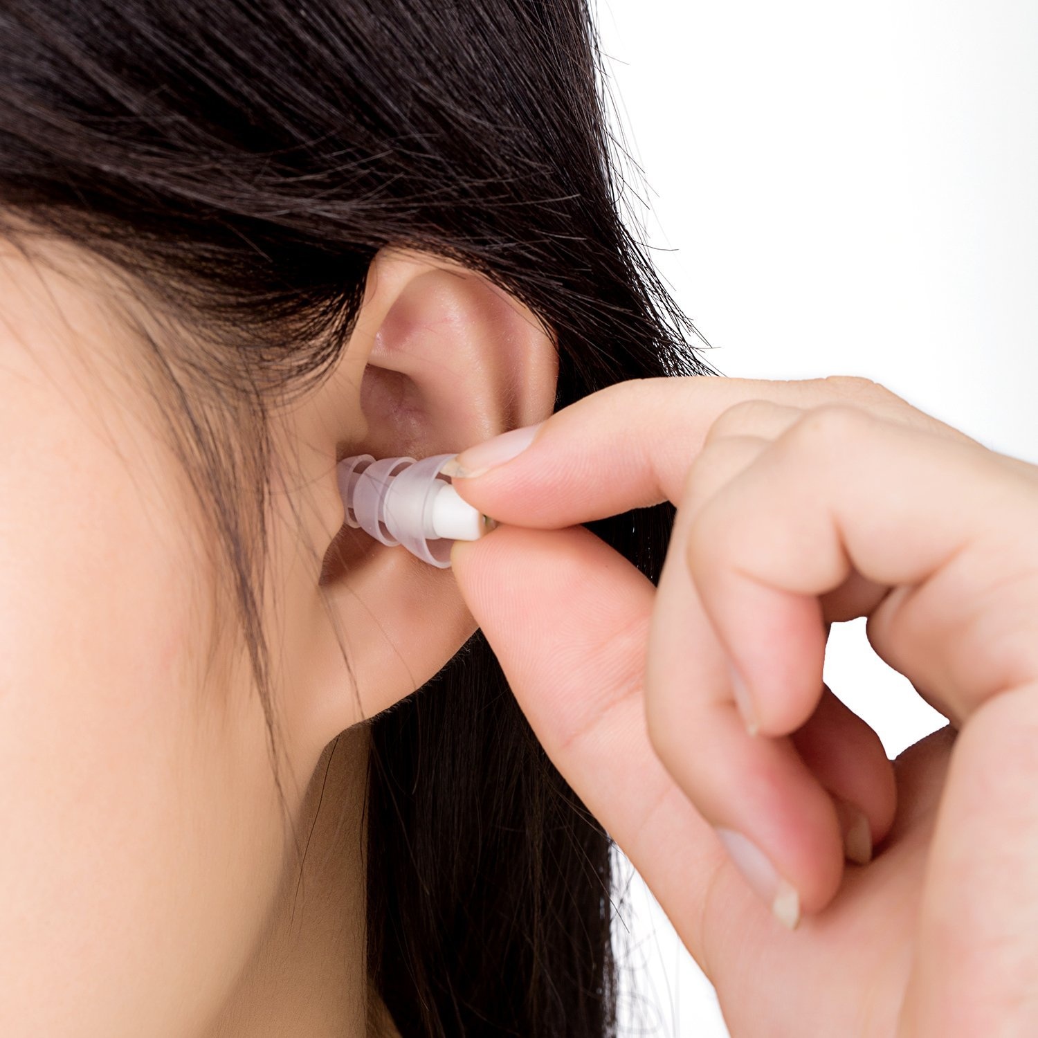 Person inserting a custom-fitted ear protection device