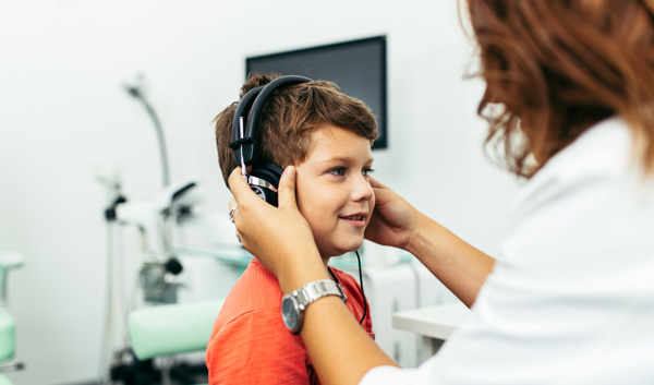 Child undergoing a hearing test with an Audiologist